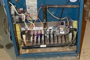 Dakota Norris 12 furnace without cover showing pilot light