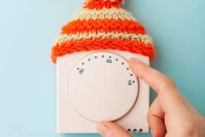 Dakota Norris 40 furnace thermostat on wall with little hat