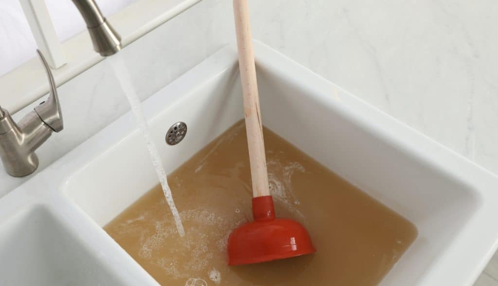 11-Steps To Flush A Water Heater (How To Drain) 10 cloudy water from sediment