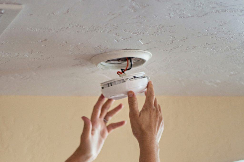 How To Fix Chirping and False Alarms of Smoke Detectors (And Carbon Monoxide) 4 removing smoke alarm from housing