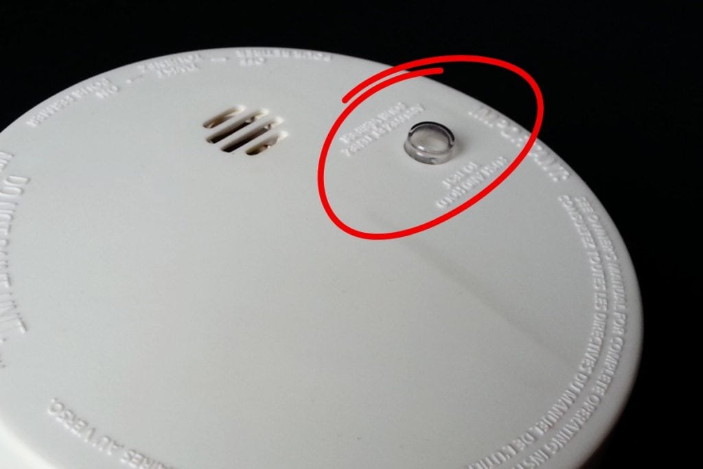 How To Fix Chirping and False Alarms of Smoke Detectors (And Carbon Monoxide) 8 test reset button on smoke alarm